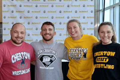 Zain Retherford and Kylie Welker with other assistant coaches.