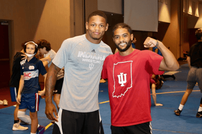 Two assistant coaches at summer wrestling camp.