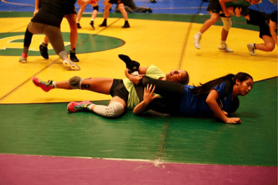 Two girls sparring at summer camp.