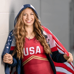 Coach Kylie Welker wearing her Team USA Wrestling Alternate singlet. 