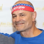 Coach Rocky Bonomo wearing a Ken Chertow wrestling camp headband. 