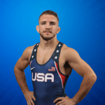 Coach Zain Retherford wearing his Team USA Olympic Wrestling singlet.