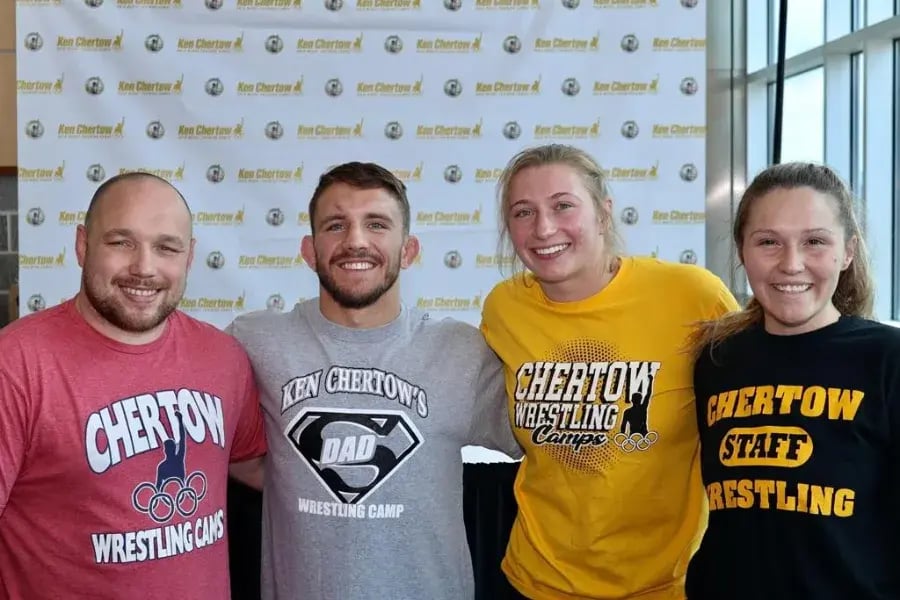 Zain Retherford and Kylie Welker with other assistant coaches.