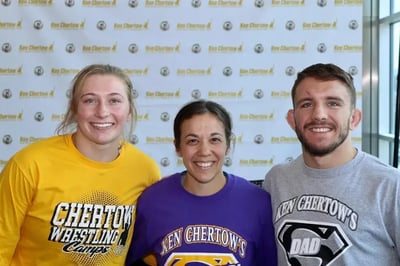 Kylie Welker, Zain Retherford, and another female coach.