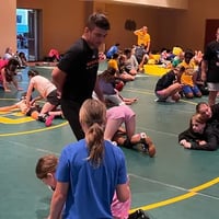 Coach Pat Glory supervising the girls gold medal summer wrestling camp. 