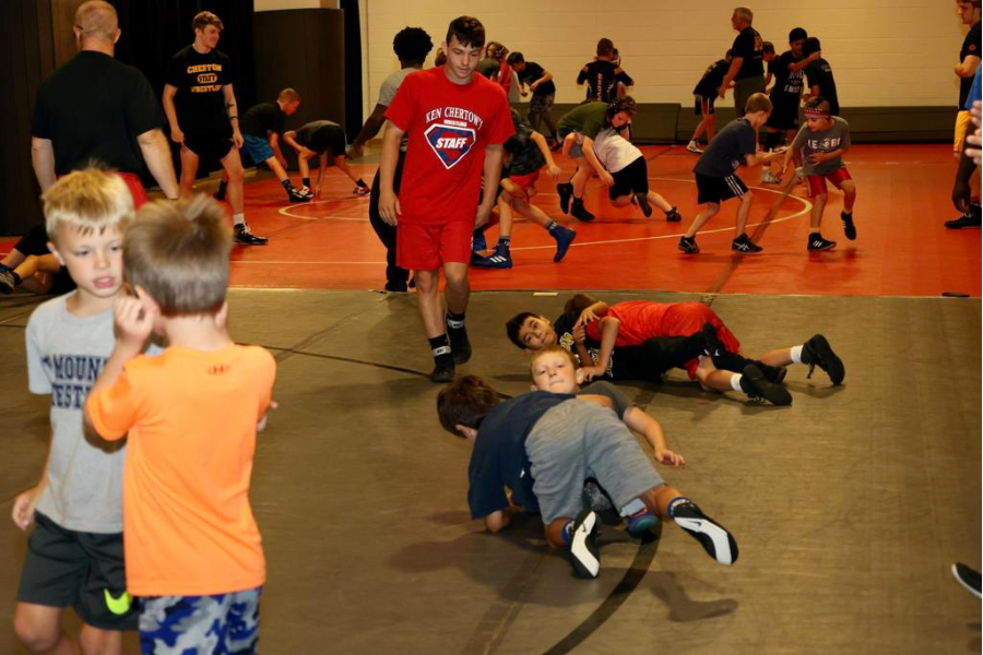 Youth wrestlers sparring at camp. 