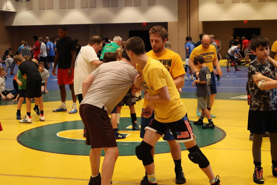 Two teen boy wrestlers sparring. 