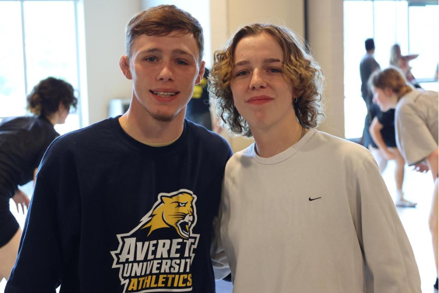 Two male teen wrestling campers. 