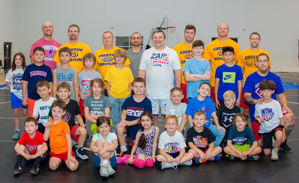 Ken Chertow and camp staff with a big group of Future Champions campers at summer wrestling camp