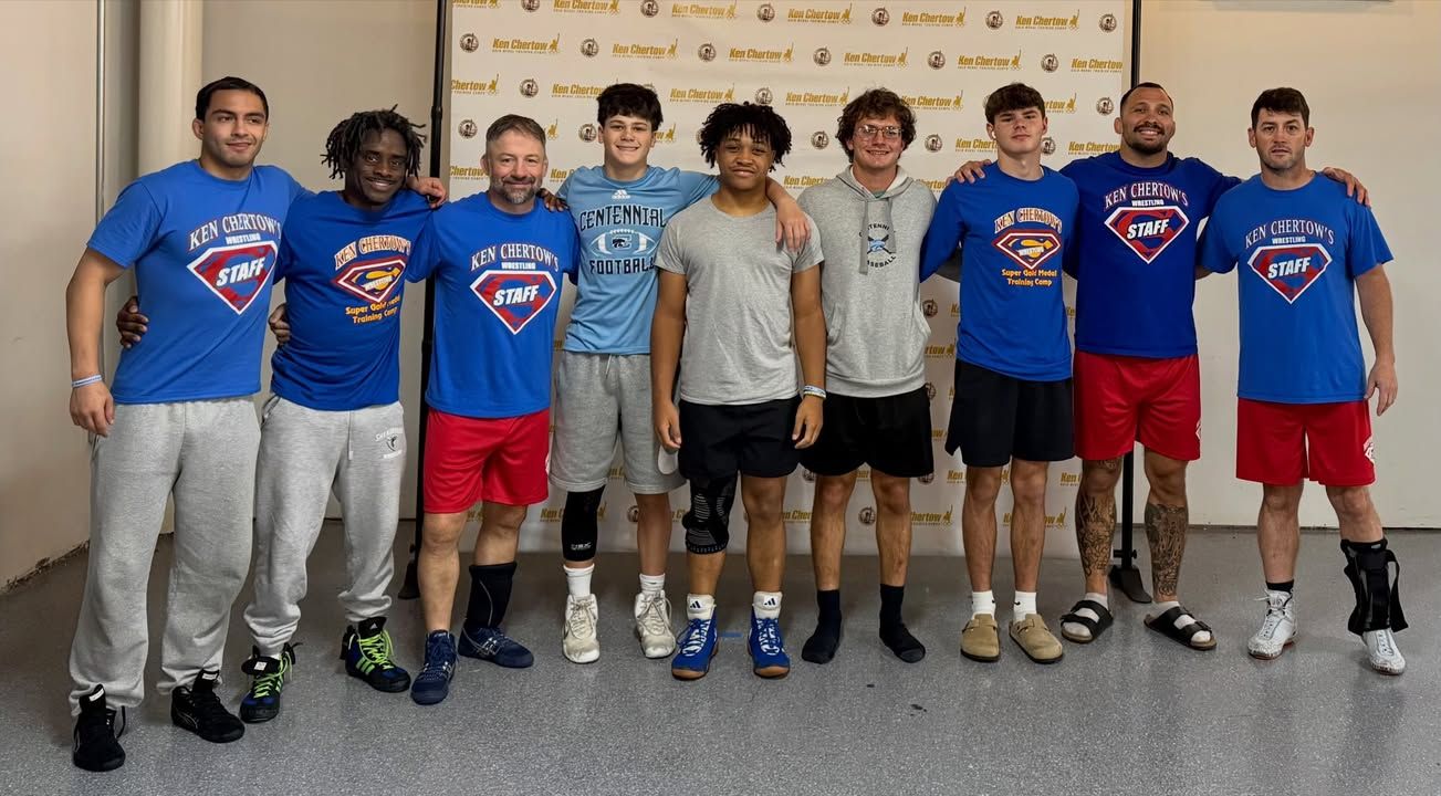 Coach Ross Brooks's team with camp staff in Chertow gear at Ken Chertow's summer wrestling camp