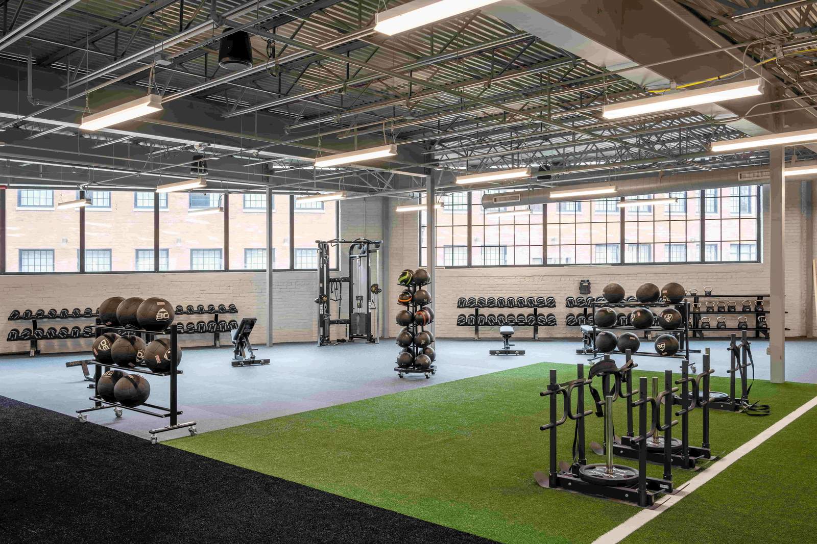 Medicine balls, kettlebells and sleds on the Champion Mill indoor turf where Ken Chertow's Ohio camp trains