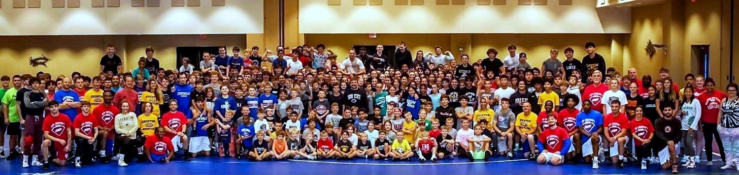 The whole camp, campers and staff, gathered for one group photo at Ken Chertow's summer wrestling camp