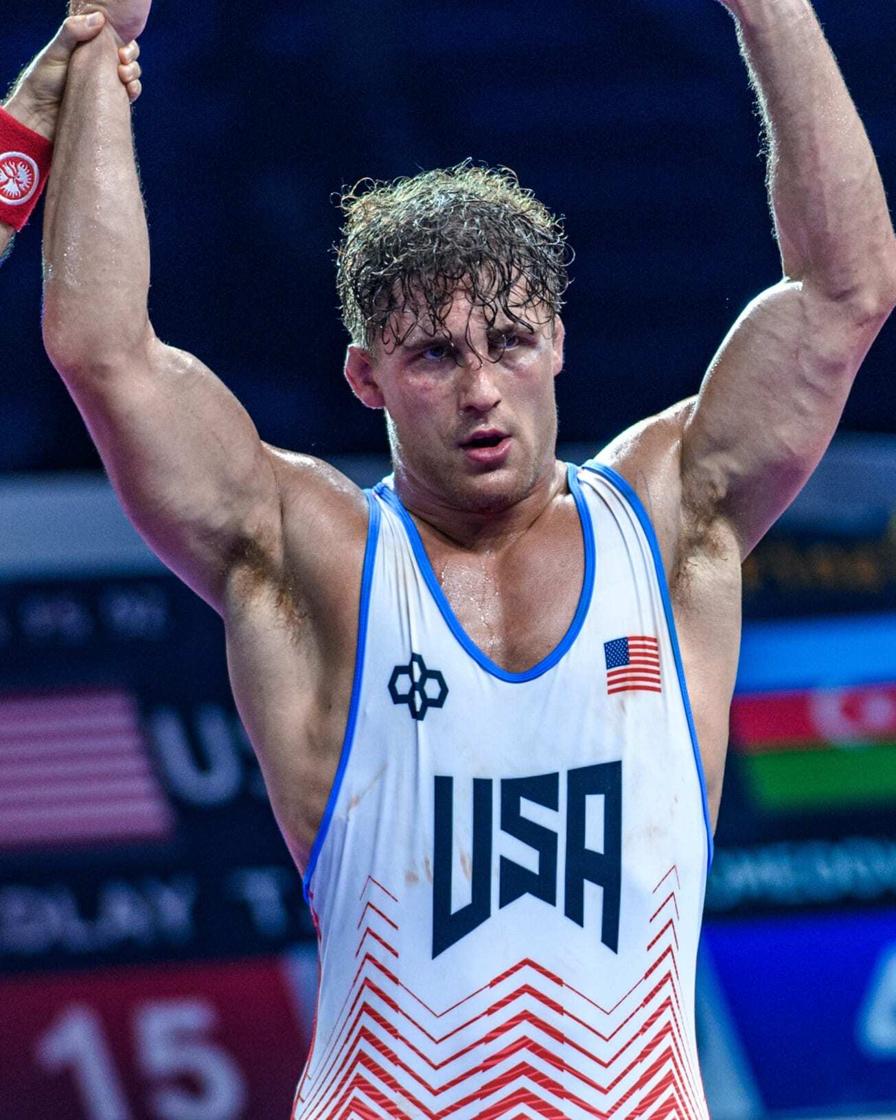 Trent Hidlay in a Team USA singlet, arms raised after a win