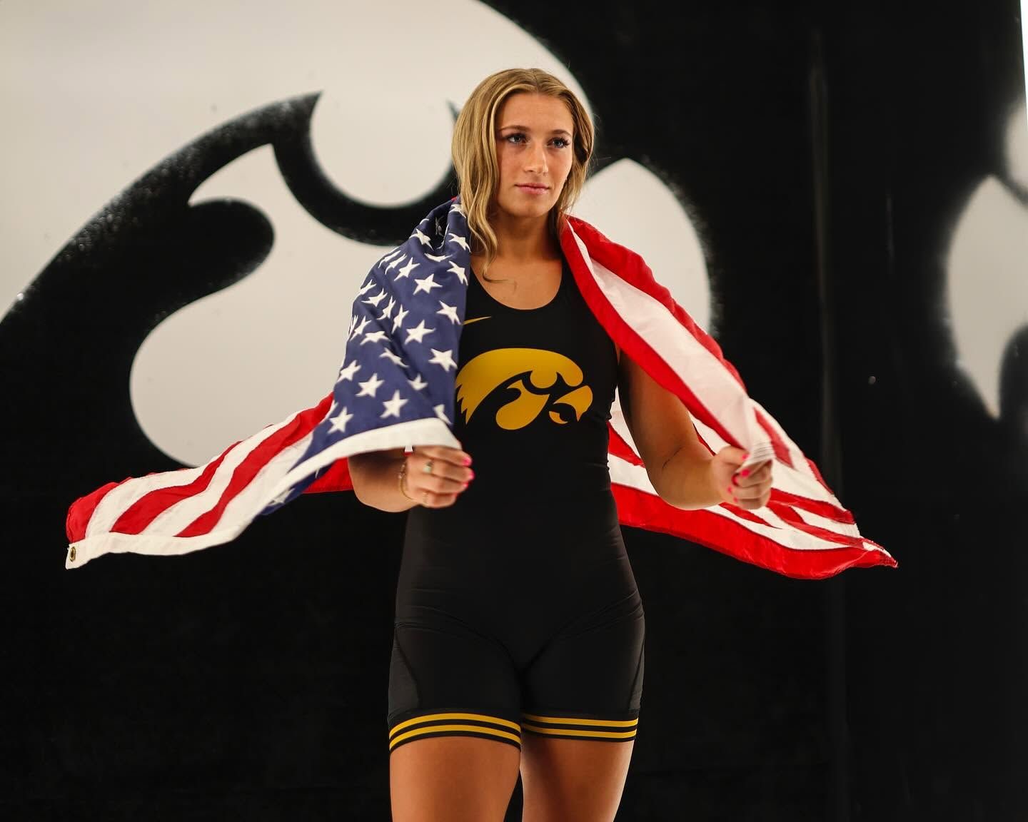 Kylie Welker wrapped in an American flag